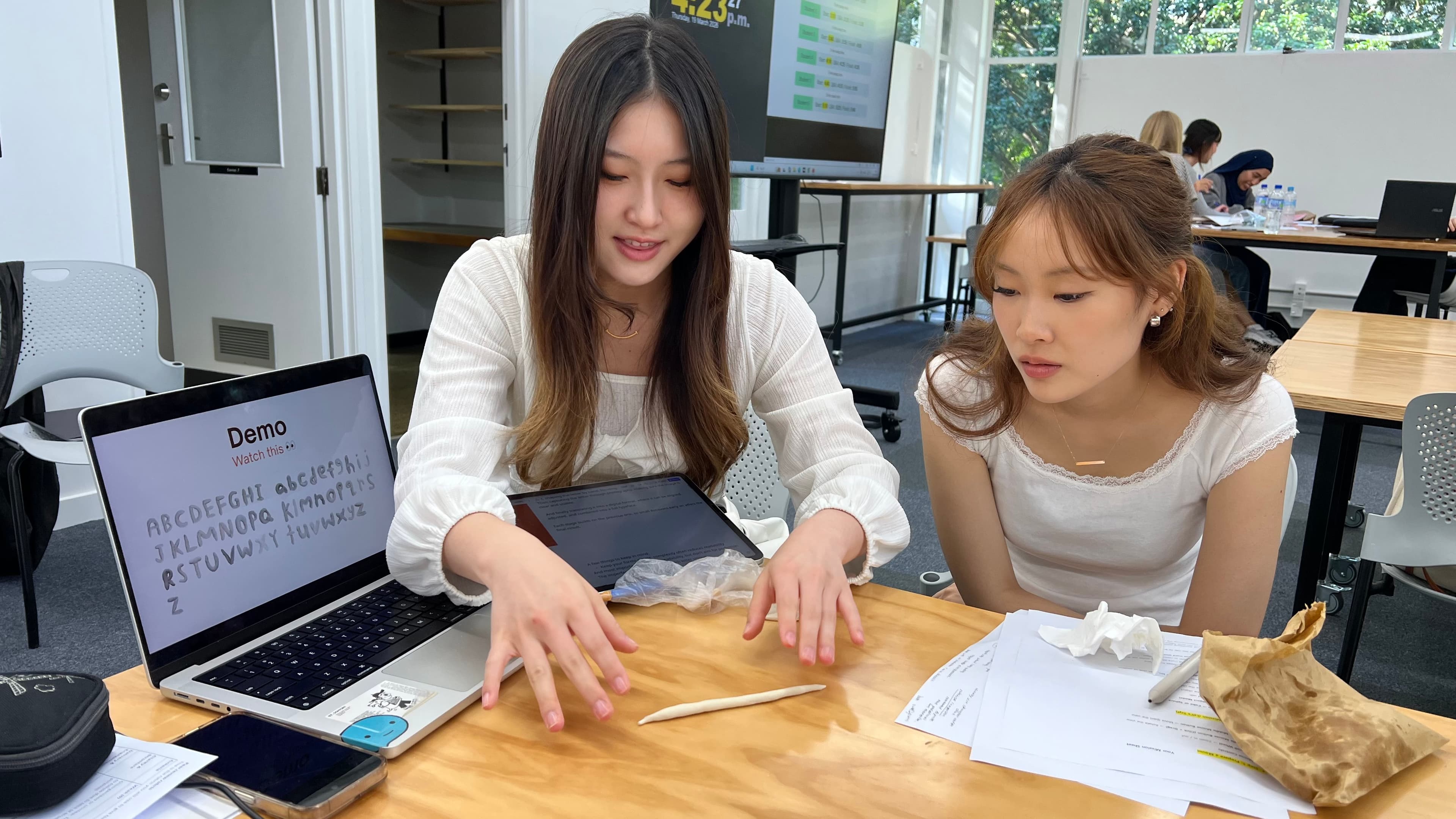 Nakyung showing her dough letter-making font demo